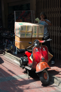 These small scooters are regarded as the most dependable working motorcycles in Bangkok.